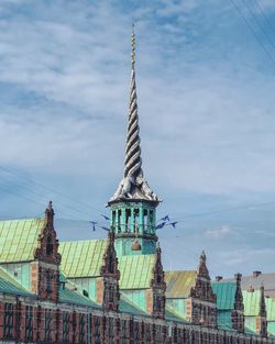 Low angle view of buildings in city against sky