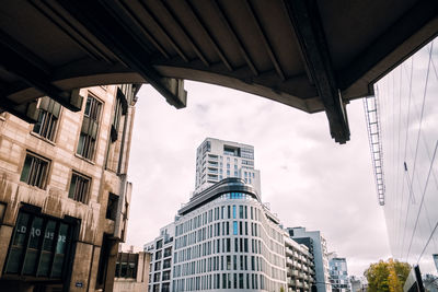 Low angle view of buildings against sky in city