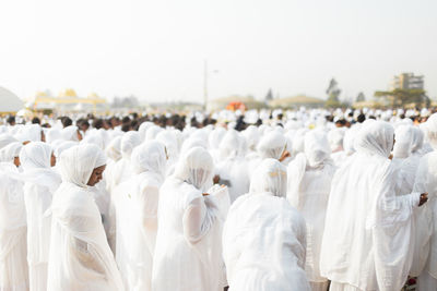 People praying in city