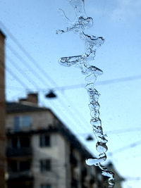 Close-up of raindrops on glass building