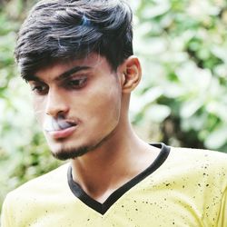 Portrait of young man looking away