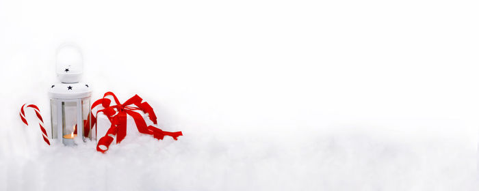 Close-up of red toy over white background