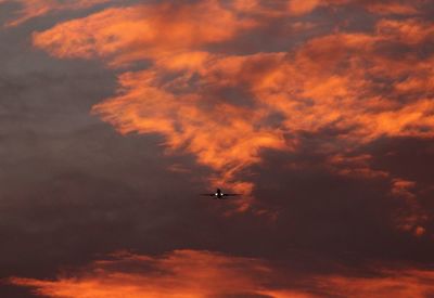 Low angle view of cloudy sky at sunset