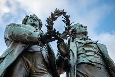 Low angle view of statue against sky