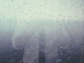 Full frame shot of wet glass window