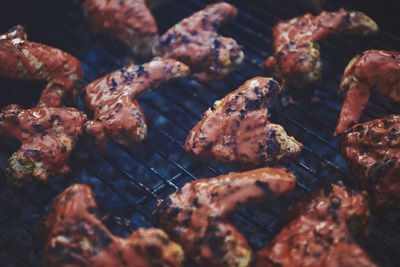 High angle view of meat on barbecue grill