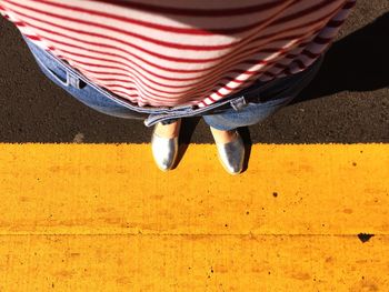 Low section of person on road