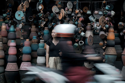 Blurred motion of people at market stall