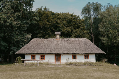 House on field against sky