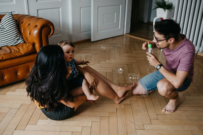 Family with bubbles at home