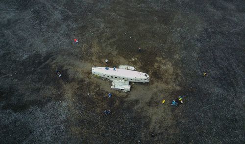 High angle view of abandoned airplane on field