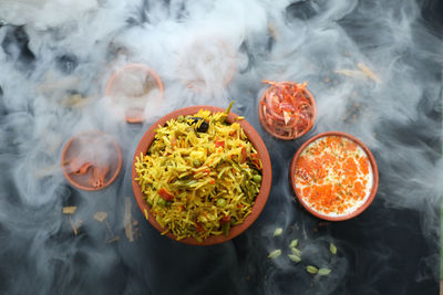 High angle view of food on table, chicken biryani