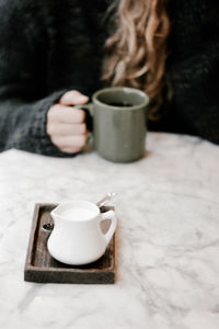 Close-up of coffee cup on table