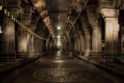 Long empty corridor along pillars