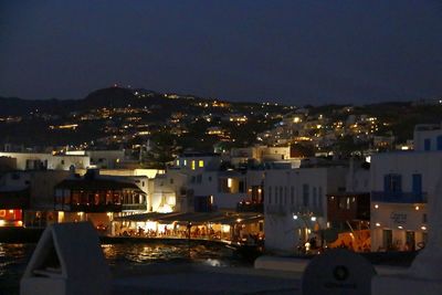 High angle view of illuminated buildings in city at night