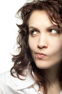 Portrait of a beautiful young woman over white background