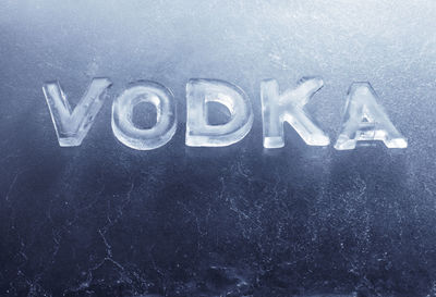 Close-up of vodka text on wall