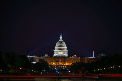 Illuminated buildings in city at night