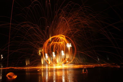 Close-up of illuminated wirewool photography against sky at night