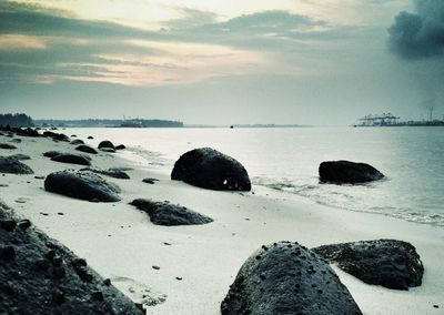 Scenic view of sea against cloudy sky