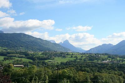 Scenic view of agricultural landscape against sky