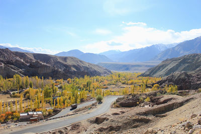 Road amidst landscape against sky