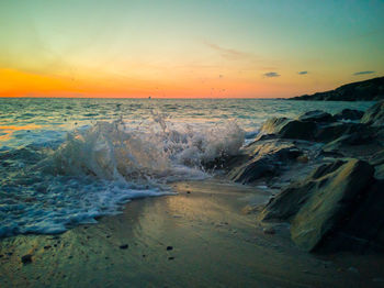 Scenic view of sea against sky during sunset