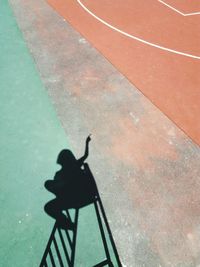 Low section of person standing on umbrella