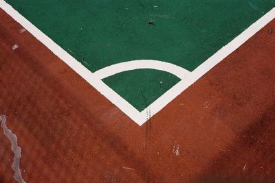 High angle view of arrow sign on field