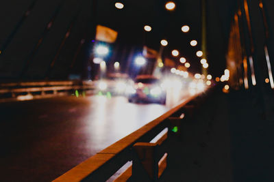 Defocused image of illuminated street at night