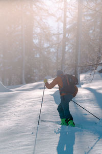 Man skiing on snow covered landscape