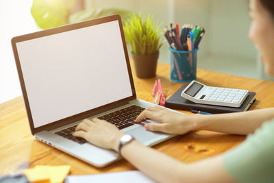 Man using laptop on table