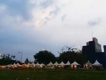 Panoramic view of buildings and houses against sky