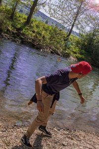 Side view of man standing on shore