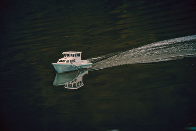 High angle view of boat floating on lake