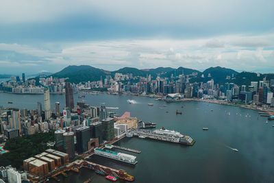 High angle view of bay and buildings against sky