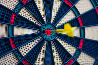 Close-up of dartboard with arrow