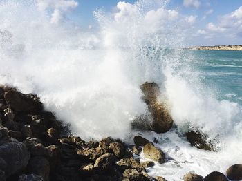 Waves splashing on rocks