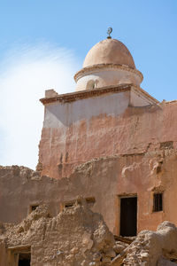 Low angle view of old building against sky