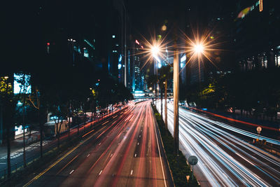 High angle view of light trails on road at night