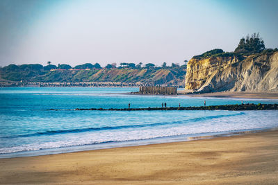 Scenic view of bay against clear sky