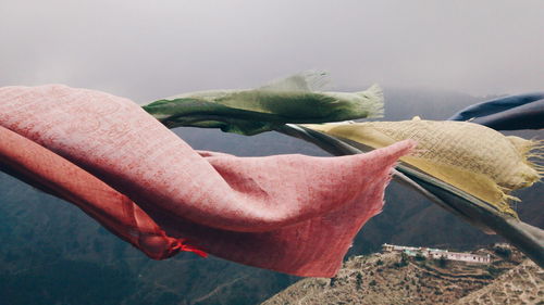 Prayer flags waving above mountains
