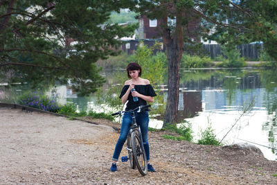 Woman 40-44 years old on a bicycle. the girl decided to get in shape for the beginning of summer.