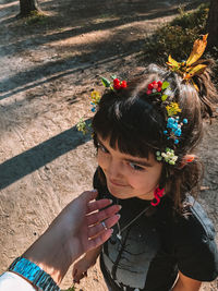 High angle view of woman holding flowers