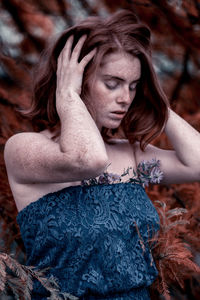 Close-up of young woman with eyes closed