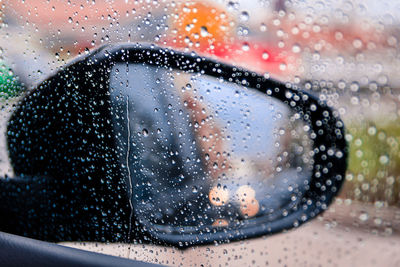 Close-up of raindrops on glass window