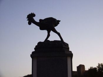 Low angle view of statue against sky