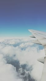 Aerial view of clouds over landscape seen from airplane