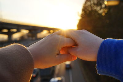 Close-up of hands against blurred background