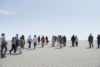 Group of people walking on the road